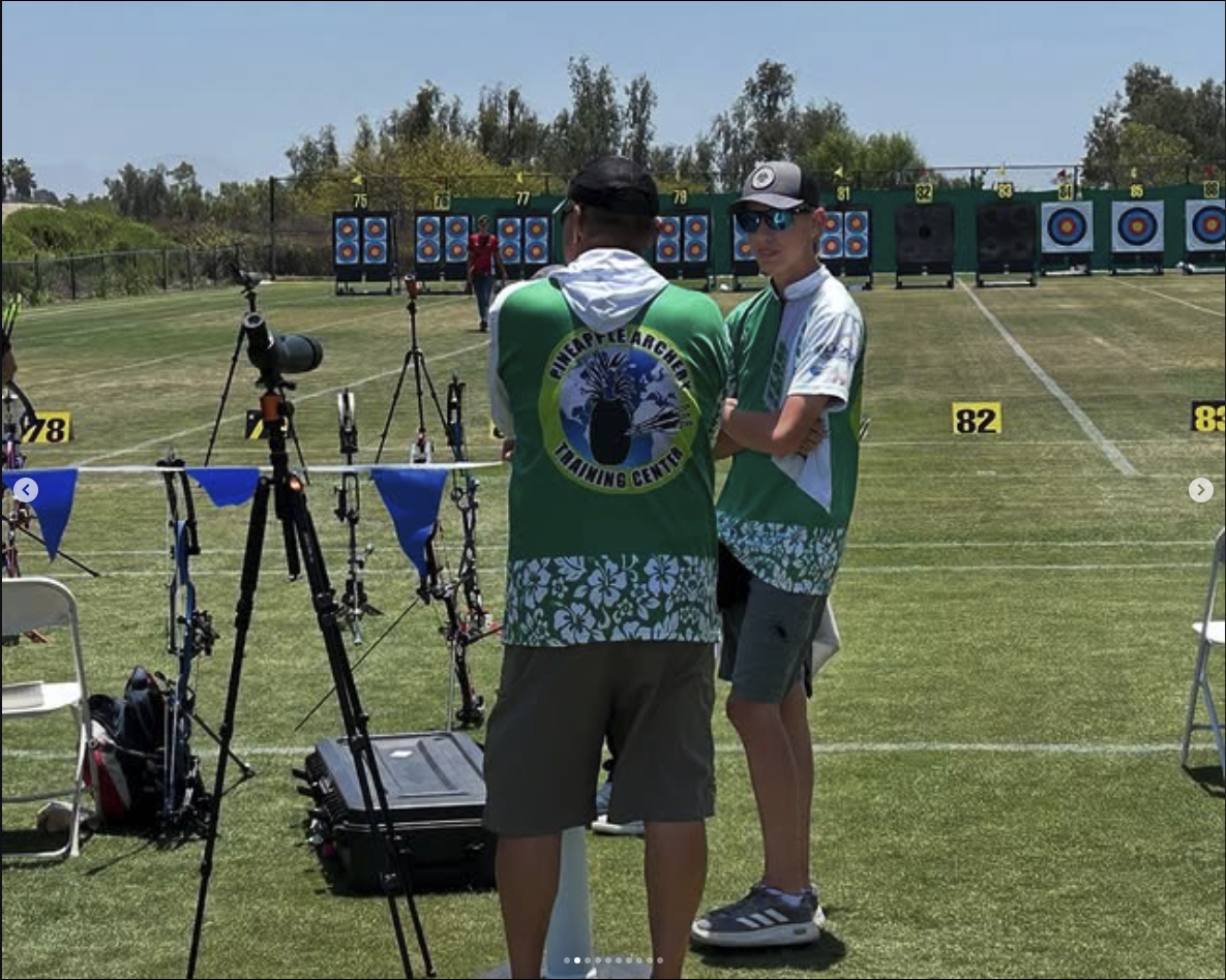 Ian Wells on the line with archery coach Mel Nichols of Pineapple Archery Training Center
