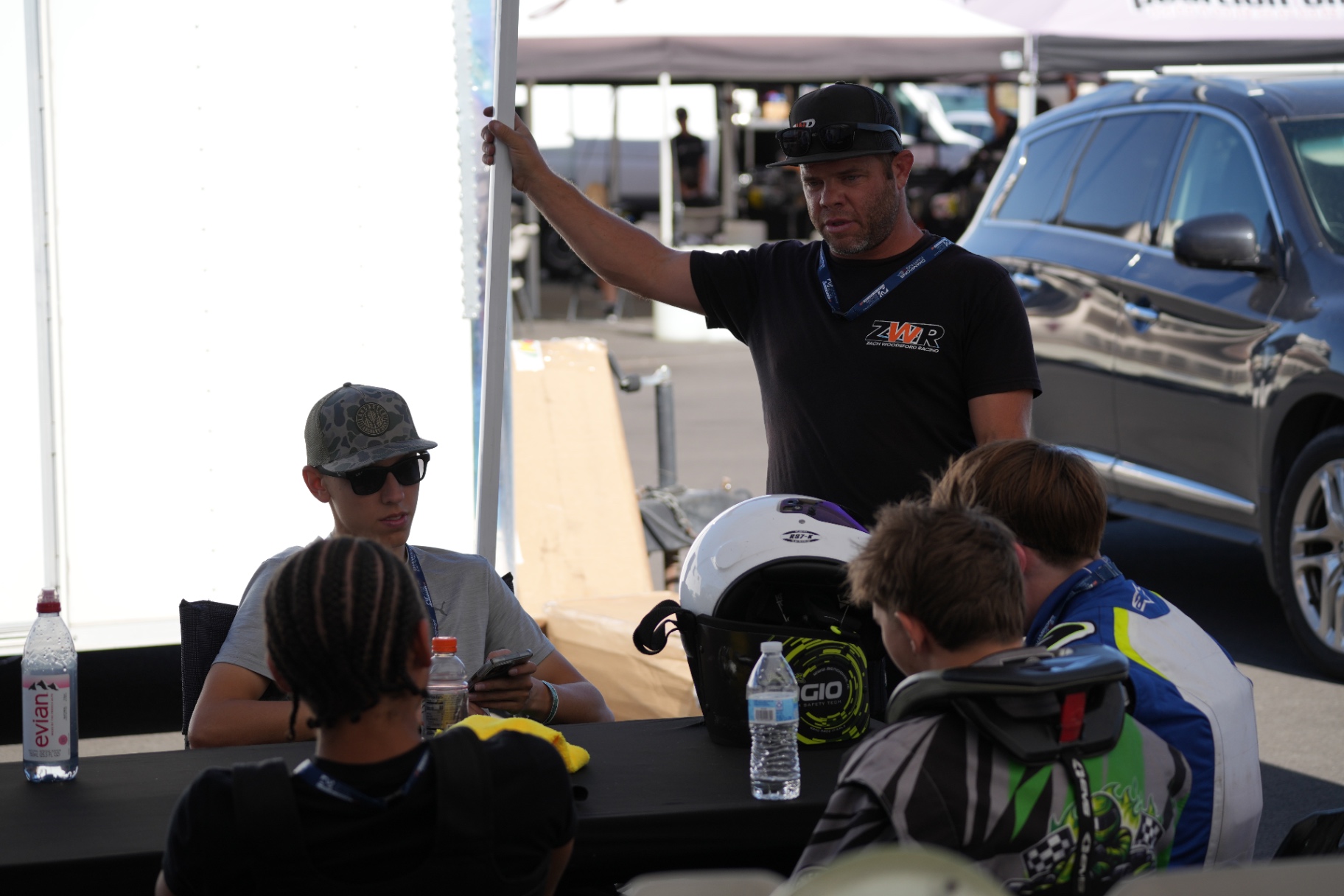 Zach Woodsford, head driving coach, in driver meeting with Ian Wells
